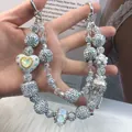 Exquisite hand-beaded luxury phone strap featuring silver crystal beads and heart charm - Silver White Phantom Color Heart Style (A5-M)