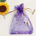 Elegant purple organza gift bag featuring gold foil stars and moon pattern drawstring - Dark Purple