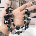 Luxury handmade beaded phone strap featuring a black bear and sparkly crown charms - Chanel Bear Crown Pendant Style (B2-B)