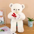 Ours en peluche blanc tenant un cœur décoratif avec des roses brodées et l'inscription Love - Ours Blanc avec Cœur de Roses / 55 cm