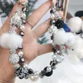 Handmade beaded phone strap featuring elegant pearls, crystals, and soft white pom-poms - Black and White Crystal Bead Disco Ball Style (B2-H)