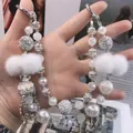 Elegant white handmade beaded bag chain with soft fur balls and luxury pearl accents - Dior Brand Logo Crown Style (C2-A)