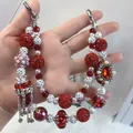 Luxury handcrafted red and white beaded phone charm featuring a large rhinestone pendant - Red Lady Style Gem Tassel Style (C2-Q)