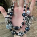 Luxury handmade beaded phone charm featuring black beads and a crystal butterfly. - Black Silver Butterfly Rhinestone Flower Cluster Style (C2-V)