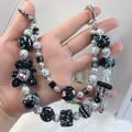 Luxurious handmade beaded phone chain featuring a black rhinestone bear and pearl accents - Black Pink Rhinestone Ball Bear Crown Style (D2-B)