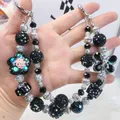 Handmade black and silver beaded phone chain with elegant flower and bow-tie pendants - Black Silver Flower Bow Beaded Style (D2-I)