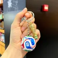 Close-up of a FIFA World Cup football keychain with trophy pendant - World Cup Football Keychain + Medium-sized World Cup Trophy