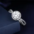 Elegant silver-finish halo moissanite ring with split shank and pavé side stones. - Adjustable Open Ring / Crisscross Twisted Halo Style (MS292) / Silver