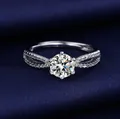 Elegant silver Moissanite ring with a 1-carat round stone on dark blue silk background. - Adjustable Open Ring / Twisted Shank Six-Prong Style (MS279) / Silver