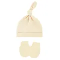 Close-up view of soft cream baby knotted hat and matching anti-scratch mittens set - One Size / Apricot