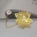 Elegant golden brass lotus bookmark with hollow leaf vein design and white daisy charm. - Lotus