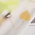 Delicate gold brass hollow leaf bookmark with planet charm chain for students gift - Bodhi Leaf