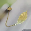 Exquisite golden brass metal bookmark featuring a delicate leaf vein design and maple leaf pendant - Olive Leaf