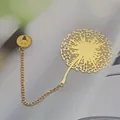 Elegant golden brass bookmark featuring a dandelion filigree and a smiley face charm - Dandelion