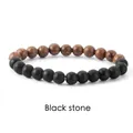Detailed view of matte black stone and wood grain bead bracelet on white background - Wood + Black Stone