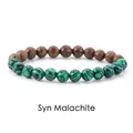 Detail view of synthetic malachite and wood bead bracelet with striped texture - Wood + Malachite