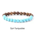 Detailed view of a synthetic turquoise and circular grain wood bead stretch bracelet - Wood + Turquoise