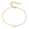 Elegant gold stainless steel heart pendant bracelet with white enamel beads on white background. - White