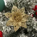 Close-up of gold glitter hollow-out poinsettia flower for Christmas tree decor - Champagne