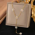 Elegant gold Y-shaped necklace with white pearl flower charms on a display box - Five Artificial Pearl Flowers (H1177)