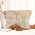 Cream corduroy cosmetic bag featuring vibrant colorful bow prints and a gold zipper - Beige Colorful Bow (FP223746)