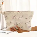 Detail of corduroy makeup bag with watercolor cat and pink bow prints - Beige Cat Bow (CH210687)