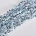 Macro view of 4mm triangular electroplated crystal beads with iridescent shimmer - 4mm (120-125 Pcs) / Ivory