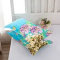 Detailed view of sky blue floral pillowcases featuring elegant purple and beige peony patterns - Charming Orchid