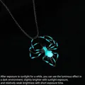 Luminous spider pendant necklace showing glow-in-the-dark effect for Halloween - Ice Blue Luminous