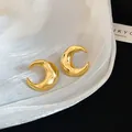 Elegant 18k gold plated crescent moon stud earrings featuring a smooth hammered texture - Gold Hammered Crescent Moon C-Shape Style
