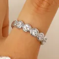 Elegant silver stainless steel ring featuring circular clusters of sparkling white zircons - Clustered Rhinestone Thin Ring (S24) / Silver