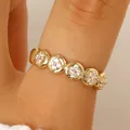 Gold plated stainless steel eternity ring featuring dainty zircon flower stations for women - Clustered Rhinestone Thin Ring (7309) / Gold