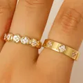 Elegant gold stainless steel stackable rings with sparkling clover zircon stone insets - 2 Pcs/Set / Gold