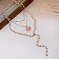 Elegant multi-layer pearl beaded necklace with a delicate pink enamel flower pendant - Gold-White-Pink