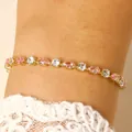 Close-up detail of elegant gold-tone bracelet with pink and clear marquise crystals - 14k Gold White & Pink Zirconia (4243)