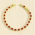Elegante bracciale tennis dorato con strass rotondi rossi e bianchi alternati da donna. - Oro Zircone Rosso Bianco