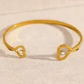Elegant gold-plated heart-shaped open cuff bracelet with small crystal accents - Double Heart Rhinestone Style (DZ-038)