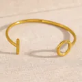 Minimalist gold-toned open cuff bracelet with elegant T-O toggle design for women - OT Buckle Style (8032)