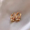 Elegant rose gold flower hoop earrings with sparkling white zirconia stones for women - Gold