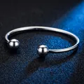 Polished stainless steel C-shaped cuff bracelet with round ball ends in silver - Bead Bracelet / Steel