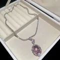 Elegant tennis necklace featuring a sparkling pink oval zircon pendant in a jewelry box - Necklace / Pink