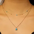 Bohemian gold layered necklace with square cracked turquoise pendant on model - Bohemian Double Layer Square Pendant Style (A-1109)