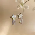 Elegant silver star earrings featuring shimmering zircon tassels and opalescent core - Silver