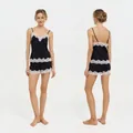 Women's black lace two-piece pajama set with camisole and shorts, front and back view - XS / Lace Trim Cami Top And Shorts (4035) / Black