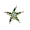 Detail view of a vintage green rhinestone starfish brooch with sparkling crystal accents. - Green Rhinestone Starfish