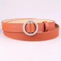 Classic tan thin leather belt for women featuring a sleek silver circular buckle - Camel