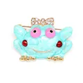 Whimsical light blue enamel frog brooch with a sparkly rhinestone bow and pink eyes - Cartoon Frog Style (XH-754)