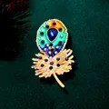 Luxurious peacock feather brooch with blue crystals and enamel on dark green velvet - Gradient Peacock Feather (XH-1589)