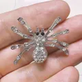 Elegant silver-tone spider brooch pin fully embellished with sparkling clear rhinestones - Silver Rhinestone Spider (XH-003)