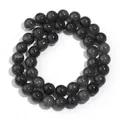 Primo piano dettagliato delle perle di vetro cracklé nere rotonde per la creazione di gioielli - 10mm (Circa 38 Perline) / Nero Floreale